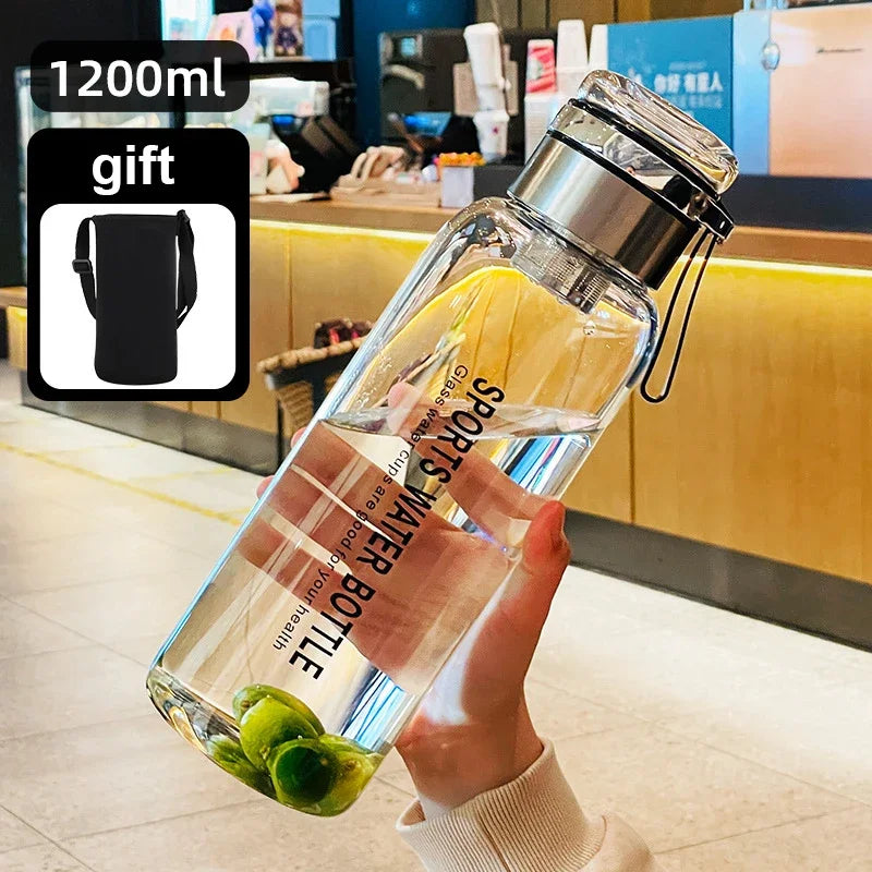 2L (67.6 fl oz) Borosilicate Glass Water Bottle – Leakproof Portable Bottle with Sleeve, Handle & Tea Filter